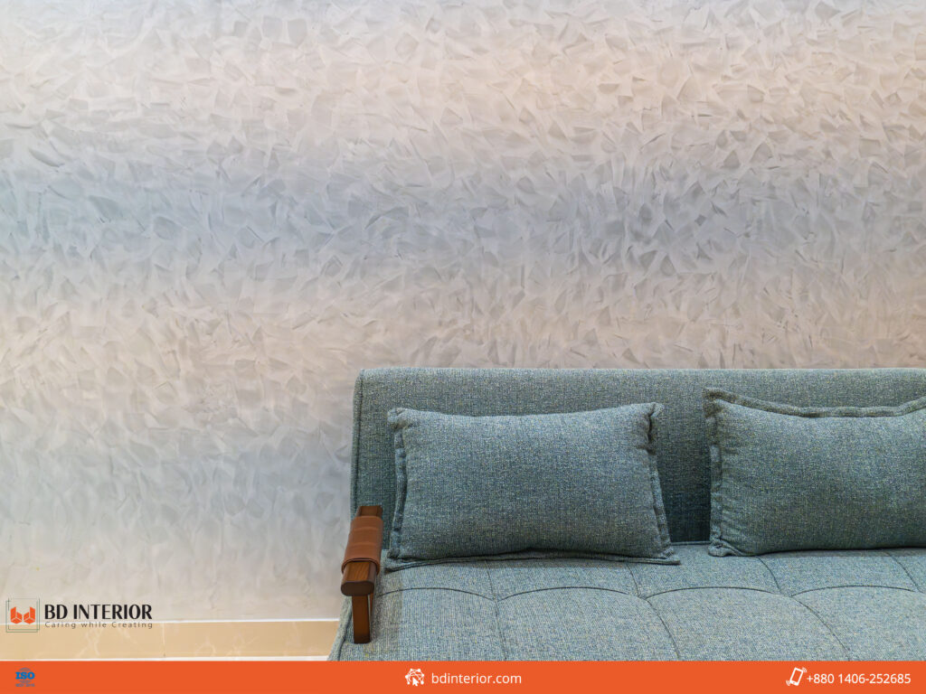 Interior Design Guide: Pro Secrets to Elevate Your Home Now 3 Textured wall and blue sofa interior design.