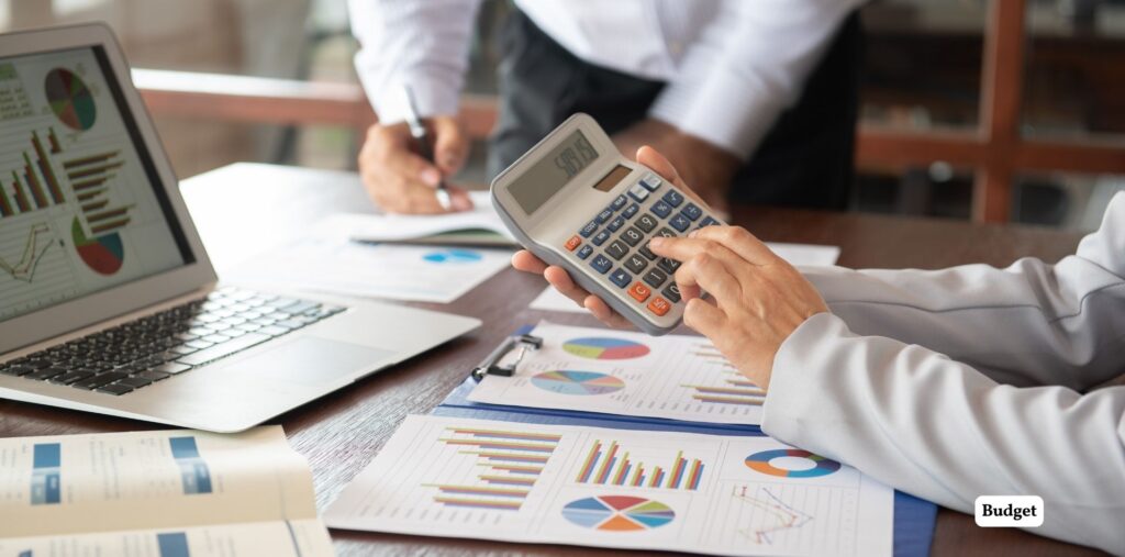 Master Interior Design Using AI: Simple Steps for Stunning Spaces 3 Office workspace with financial charts and calcula.